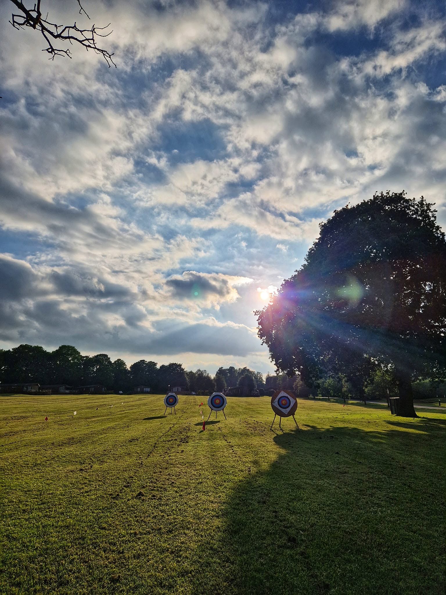 Outdoor archery field in evening sunlight